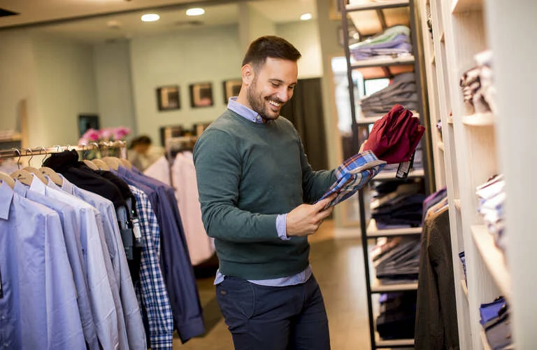 portrait-of-a-young-man-looking-at-clothes-to-buy-2023-11-27-05-04-24-utc (2)