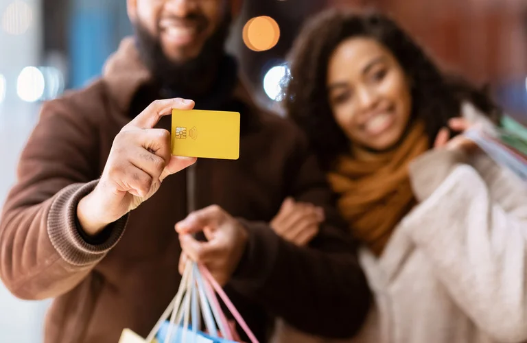 portrait-of-happy-black-couple-holding-credit-card-2023-11-27-05-09-40-utc (1) (1)